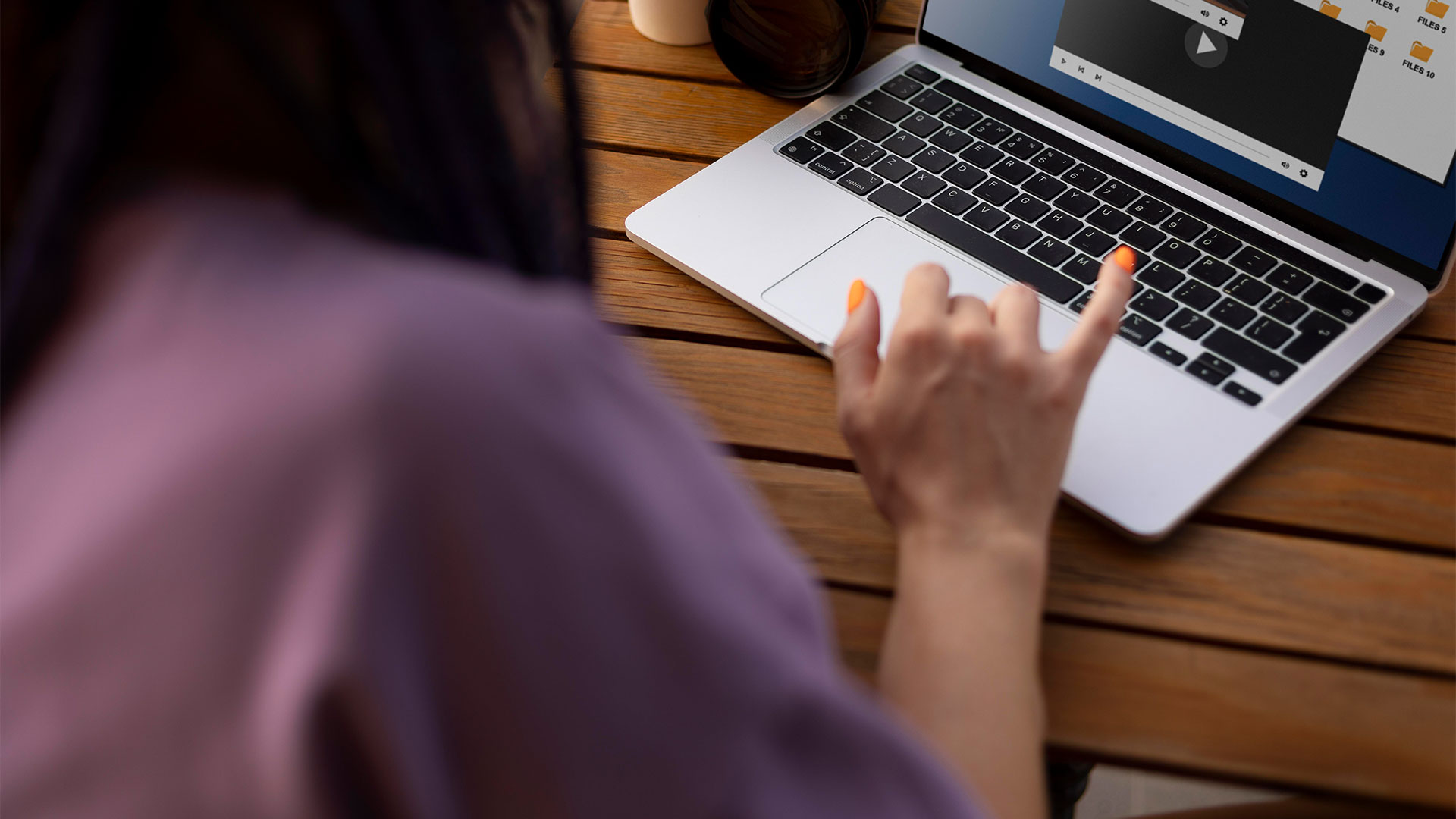 Woman editing a video on her laptop